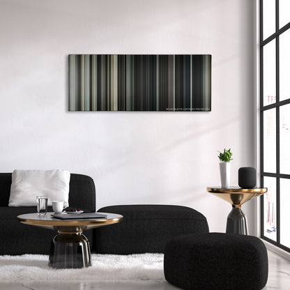 Letters from Iwo Jima color palette canvas above a black sofa with a gold-topped table