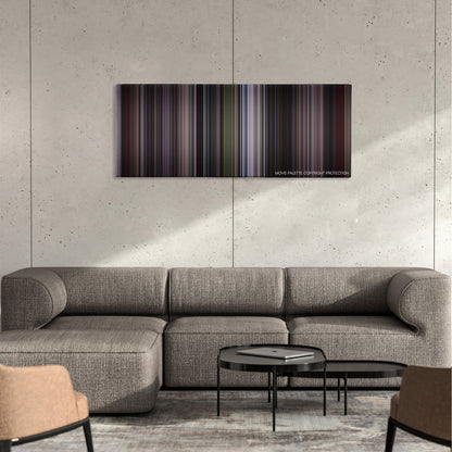 The Jackal color palette canvas on a concrete wall above a gray sectional sofa