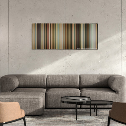 Knocked Up color palette canvas on a concrete wall above a gray sectional sofa