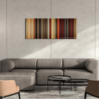 Gods of Egypt color palette canvas on a concrete wall above a gray sectional sofa