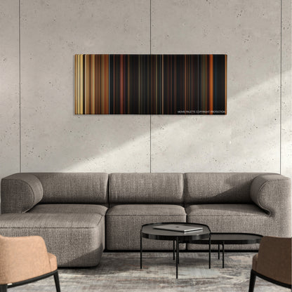 Hostage color palette canvas on a concrete wall above a gray sectional sofa