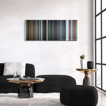 What Happened to Monday color palette canvas above a black sofa with a gold-topped table