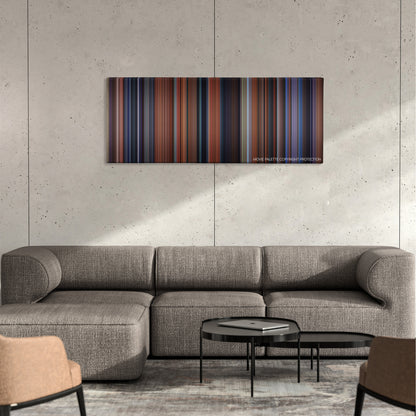 Coyote Ugly color palette canvas on a concrete wall above a gray sectional sofa
