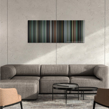 The Machinist color palette canvas on a concrete wall above a gray sectional sofa