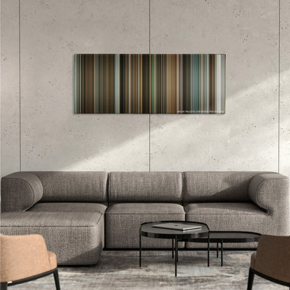 The Lives of Others color palette canvas on a concrete wall above a gray sectional sofa