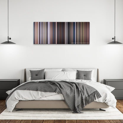 Men of Honor color palette canvas above a bed, between two black pendant lamps