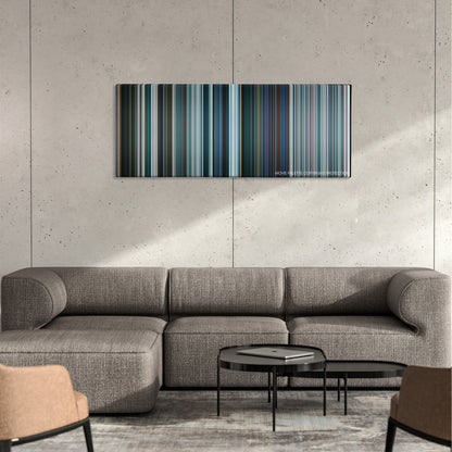 Pacific Rim: Uprising color palette canvas on a concrete wall above a gray sectional sofa