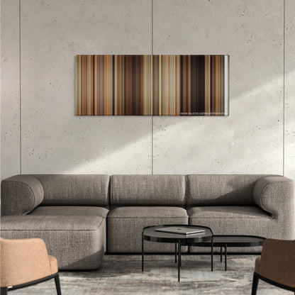Easy A color palette canvas on a concrete wall above a gray sectional sofa