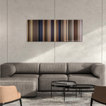 Yes Man color palette canvas on a concrete wall above a gray sectional sofa