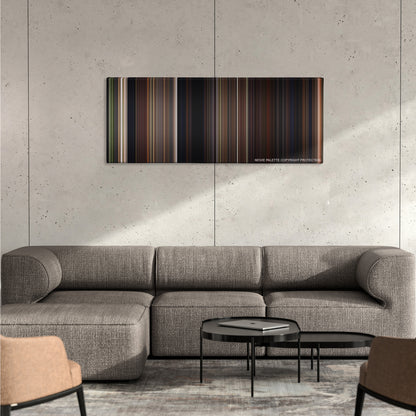 Signs color palette canvas on a concrete wall above a gray sectional sofa