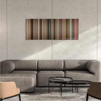 The Fighter color palette canvas on a concrete wall above a gray sectional sofa