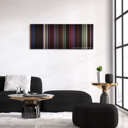 Only God Forgives color palette canvas above a black sofa with a gold-topped table