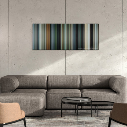 Due Date color palette canvas on a concrete wall above a gray sectional sofa