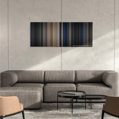 The Expendables color palette canvas on a concrete wall above a gray sectional sofa