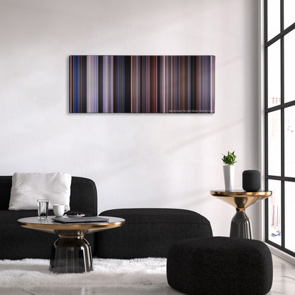 12 Monkeys color palette canvas above a black sofa with a gold-topped table