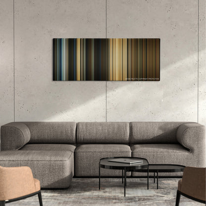 Pompeii color palette canvas on a concrete wall above a gray sectional sofa