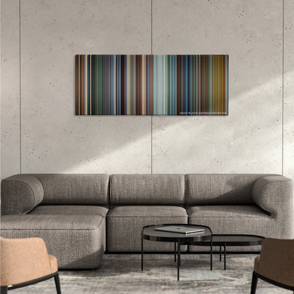 Mission: Impossible III color palette canvas on a concrete wall above a gray sectional sofa
