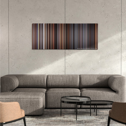 The Devil's Advocate color palette canvas on a concrete wall above a gray sectional sofa