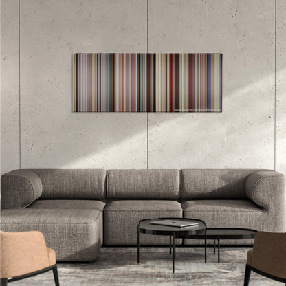 Boyhood color palette canvas on a concrete wall above a gray sectional sofa