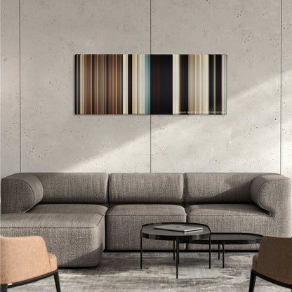 True Grit color palette canvas on a concrete wall above a gray sectional sofa