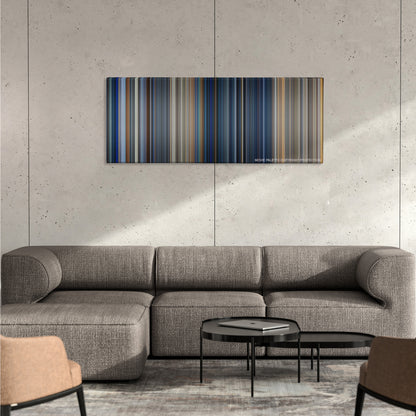 The Rock color palette canvas on a concrete wall above a gray sectional sofa