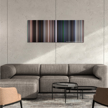 Mission: Impossible II color palette canvas on a concrete wall above a gray sectional sofa