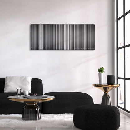 Rashomon color palette canvas above a black sofa with a gold-topped table