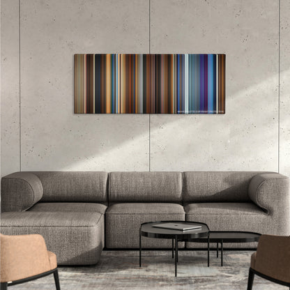 Click color palette canvas on a concrete wall above a gray sectional sofa