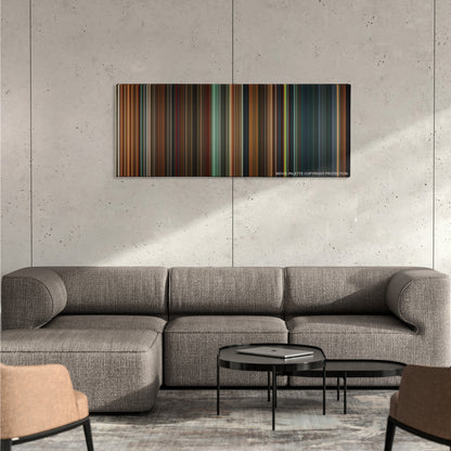 Constantine color palette canvas on a concrete wall above a gray sectional sofa