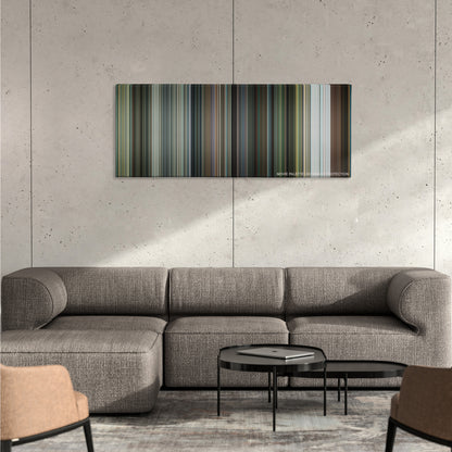 Shooter color palette canvas on a concrete wall above a gray sectional sofa