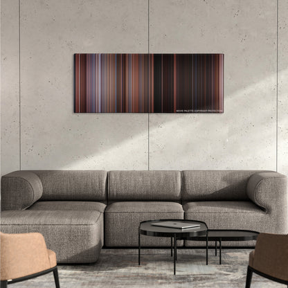 Home Alone 2: Lost in New York color palette canvas on a concrete wall above a gray sectional sofa