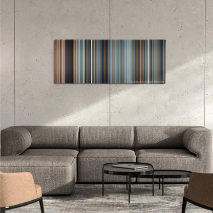 Pearl Harbor color palette canvas on a concrete wall above a gray sectional sofa