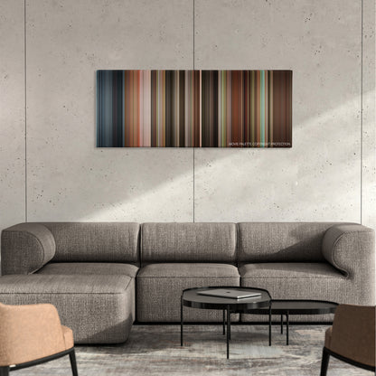 Patch Adams color palette canvas on a concrete wall above a gray sectional sofa