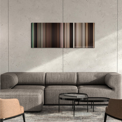 The Book of Eli color palette canvas on a concrete wall above a gray sectional sofa