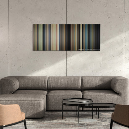 Little Children color palette canvas on a concrete wall above a gray sectional sofa