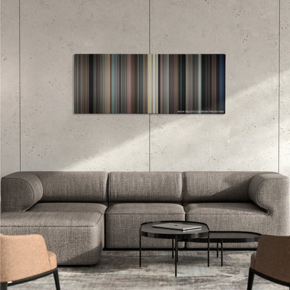 North by Northwest color palette canvas on a concrete wall above a gray sectional sofa