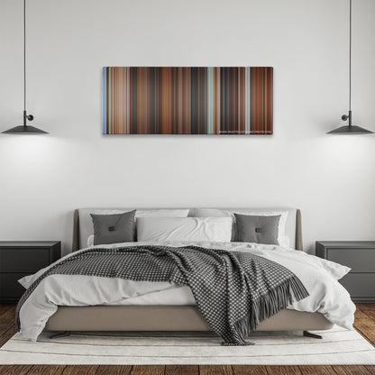 Mr. Deeds color palette canvas above a bed, between two black pendant lamps