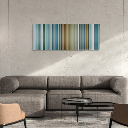 The Island color palette canvas on a concrete wall above a gray sectional sofa