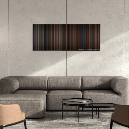 End of Days color palette canvas on a concrete wall above a gray sectional sofa