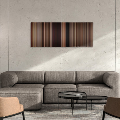 3:10 to Yuma color palette canvas on a concrete wall above a gray sectional sofa