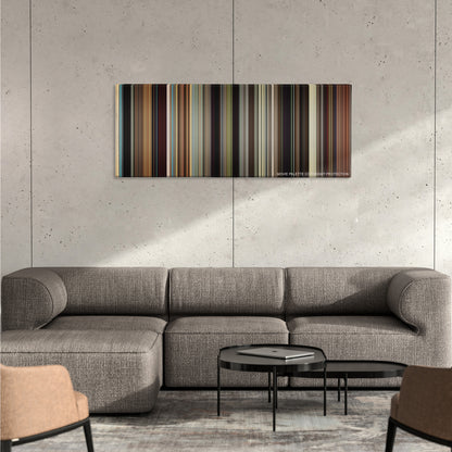 The Wrestler color palette canvas on a concrete wall above a gray sectional sofa