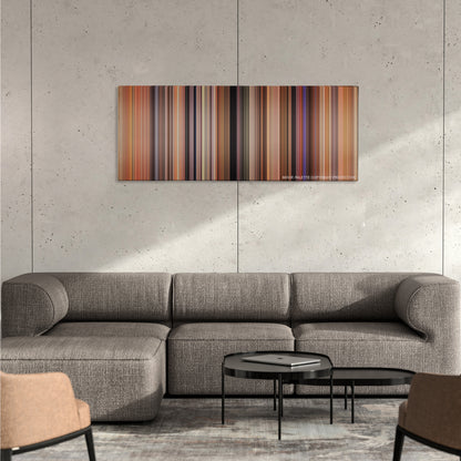 There's Something About Mary color palette canvas on a concrete wall above a gray sectional sofa