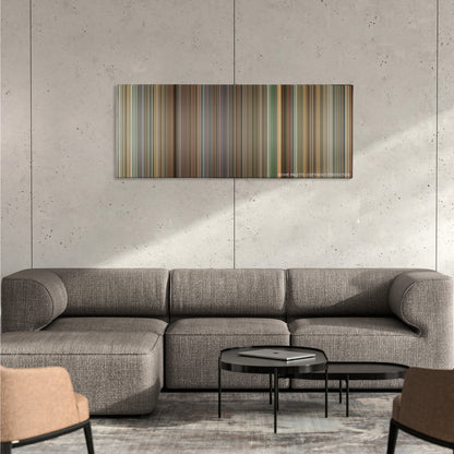 Deja Vu color palette canvas on a concrete wall above a gray sectional sofa