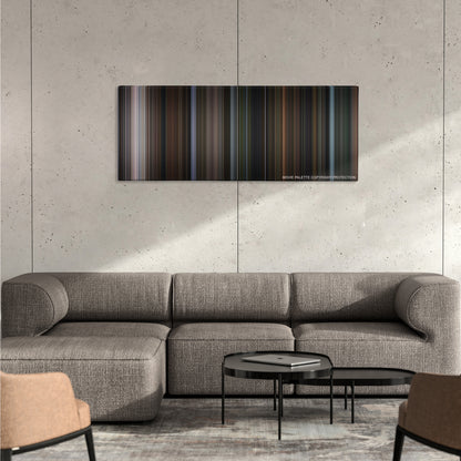 Bird Box color palette canvas on a concrete wall above a gray sectional sofa