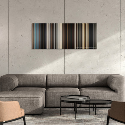 Dune color palette canvas on a concrete wall above a gray sectional sofa