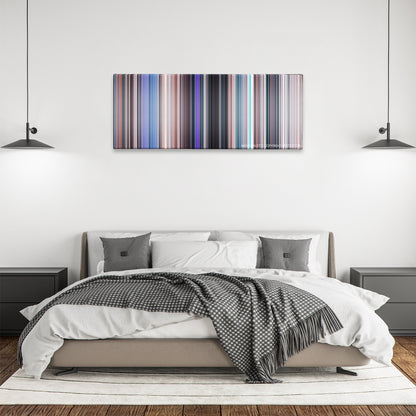 Uncharted color palette canvas above a bed, between two black pendant lamps